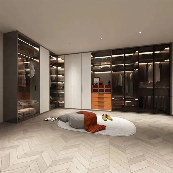Walk-in wardrobe with glass doors and island