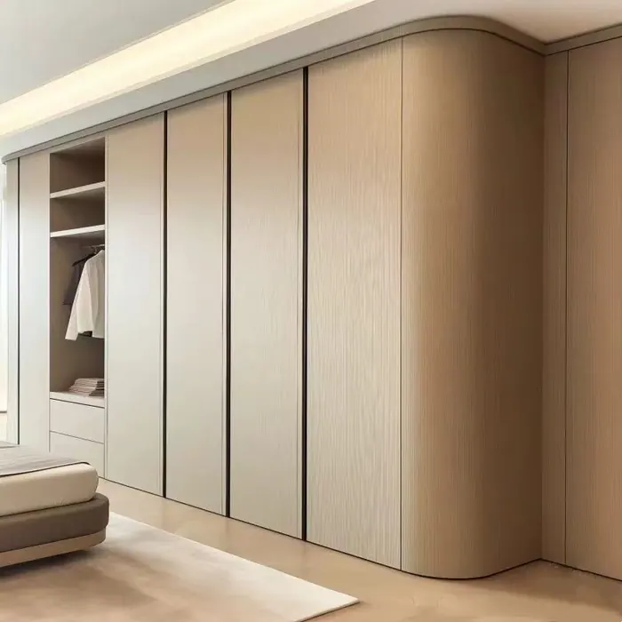 Beige wall wardrobe with curved end