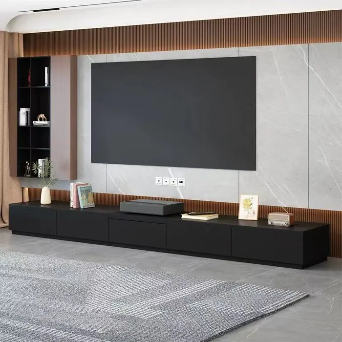 Long black TV console with feature wall