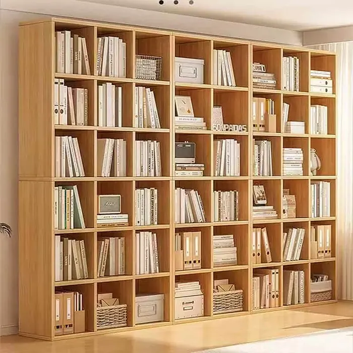Floor-to-ceiling wood bookshelf wall
