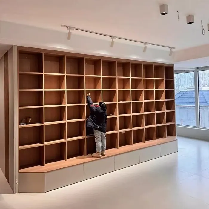 Full-wall wood cubby shelving installation