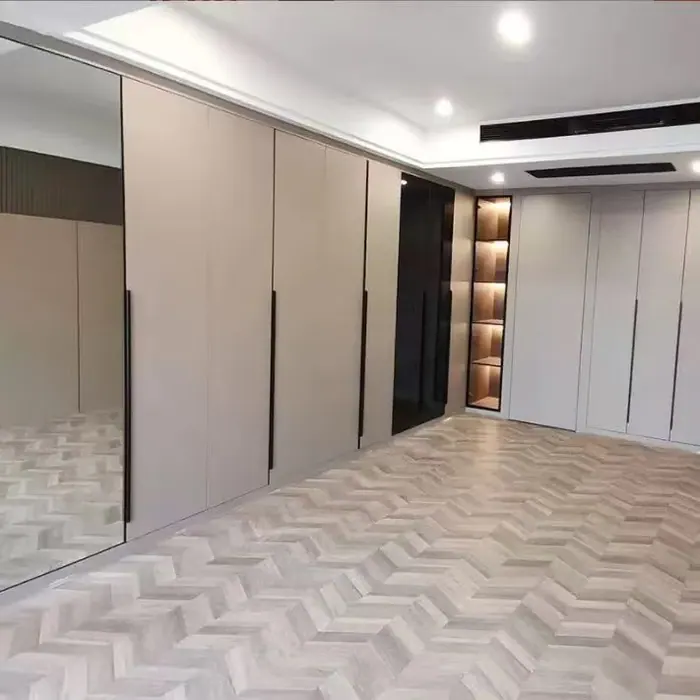 Hallway lined with full-height wardrobes