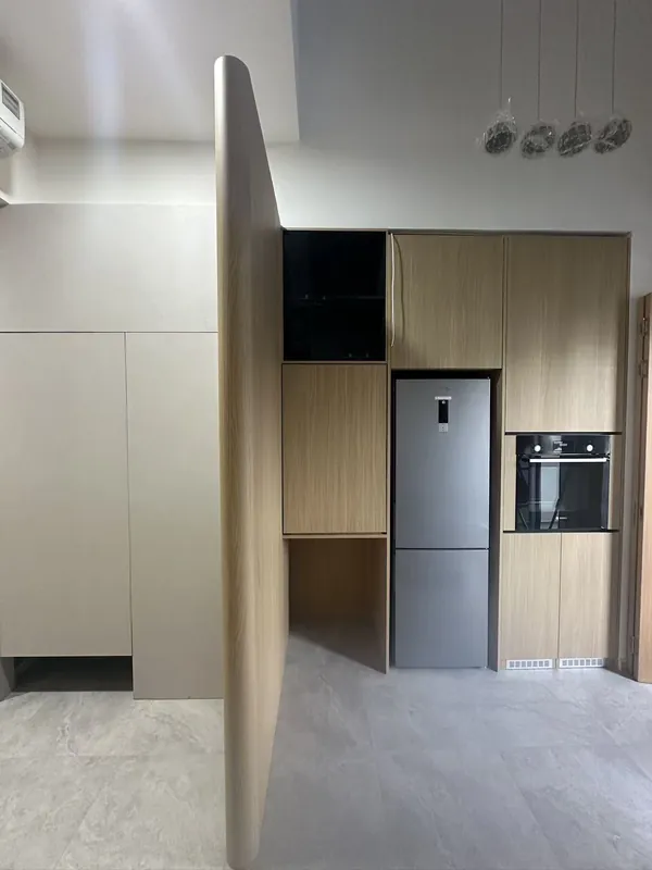 Wood-grain kitchen with integrated fridge and oven — Johor Bahru