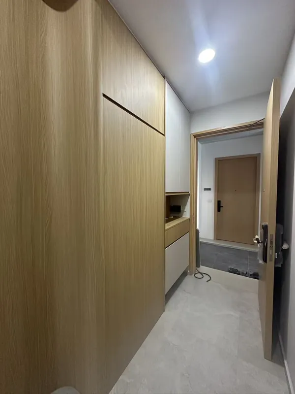 Hallway wood feature wall and entry storage — Johor Bahru