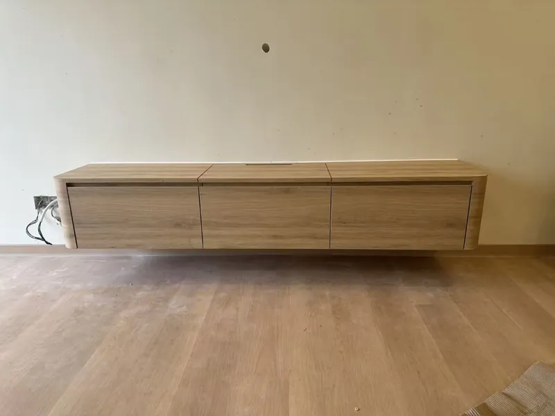 Floating light-oak TV console — Johor Bahru condo