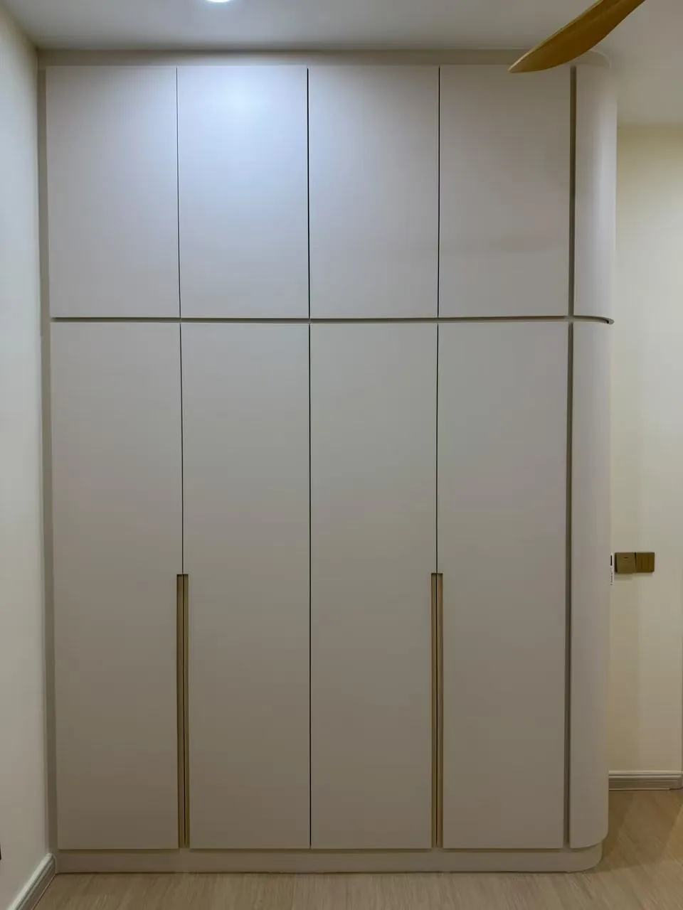 Curved-top built-in wardrobe in a Johor Bahru bedroom